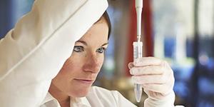 Person pipetting in a lab